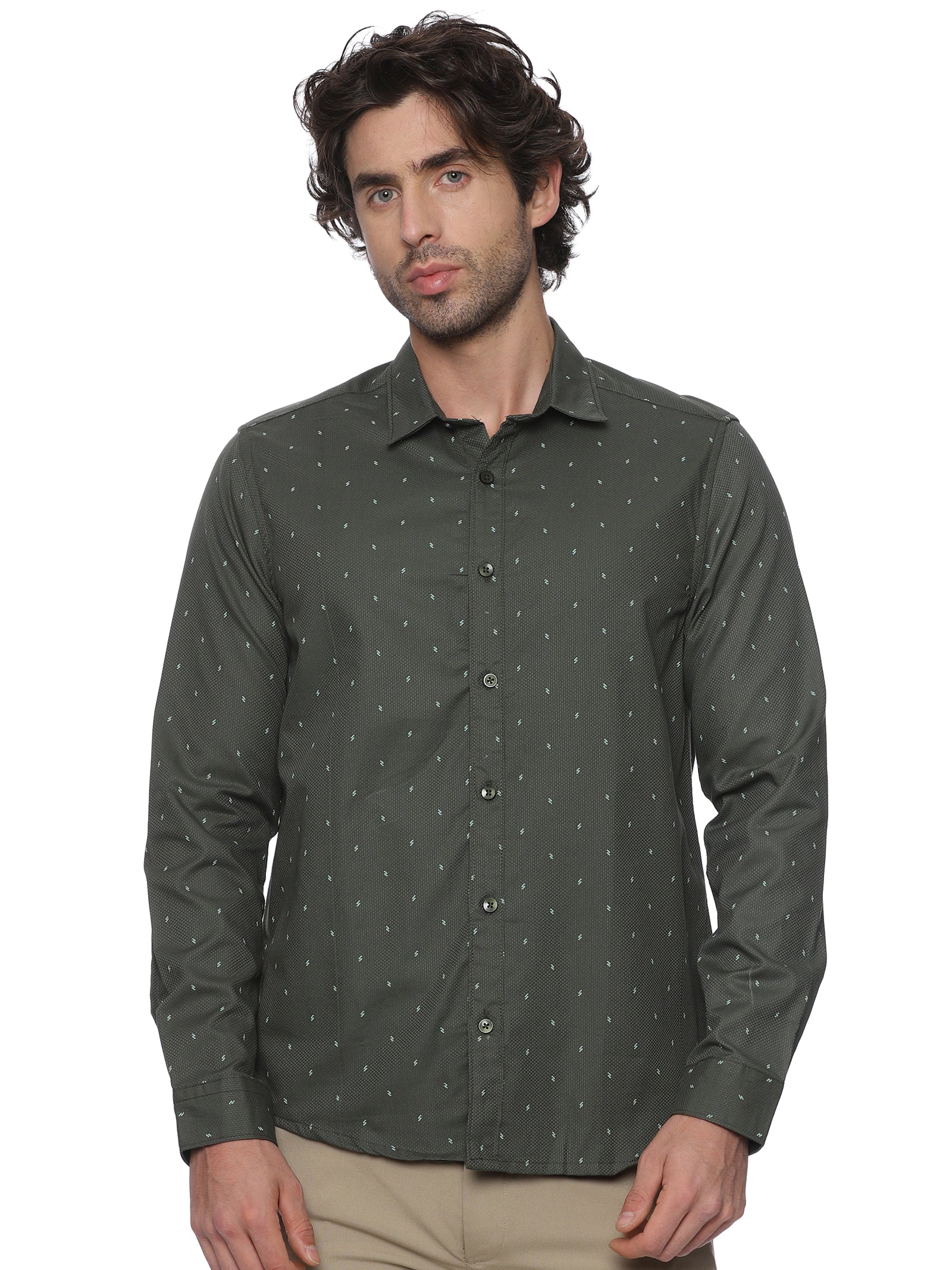 Man wearing a dark green patterned shirt on a white background