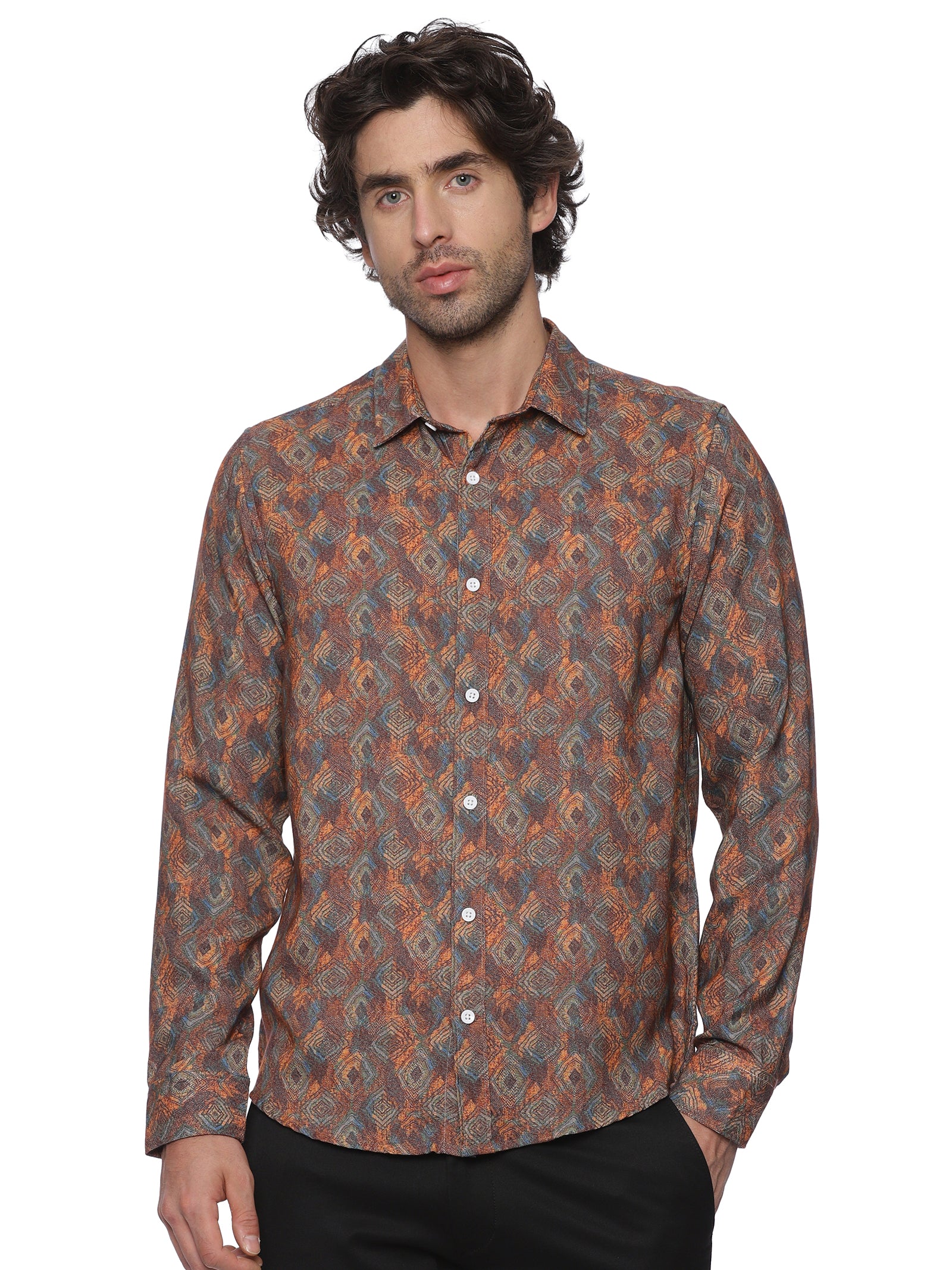 Man wearing a patterned shirt on a white background
