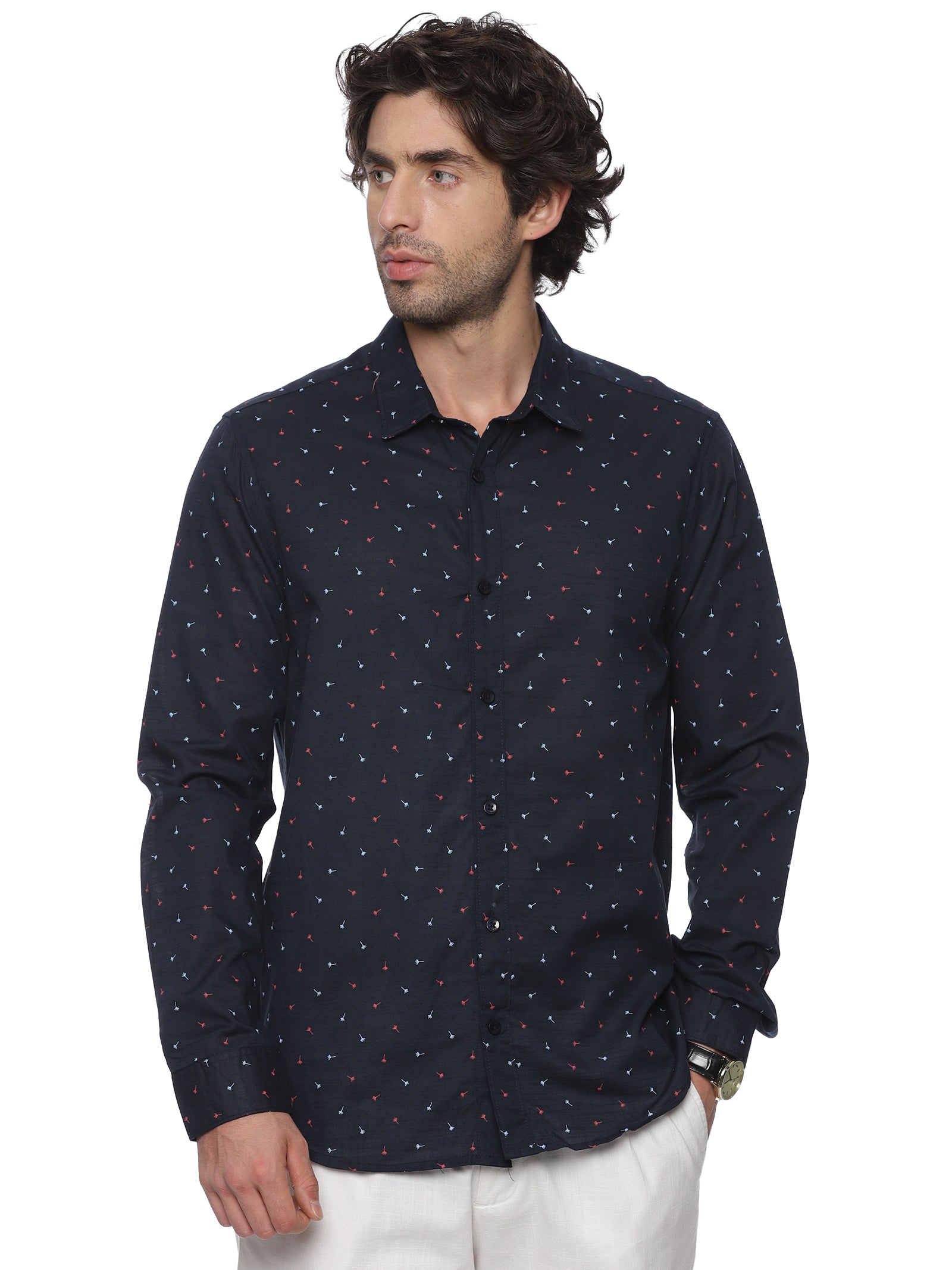 Man wearing a navy blue patterned shirt on a white background